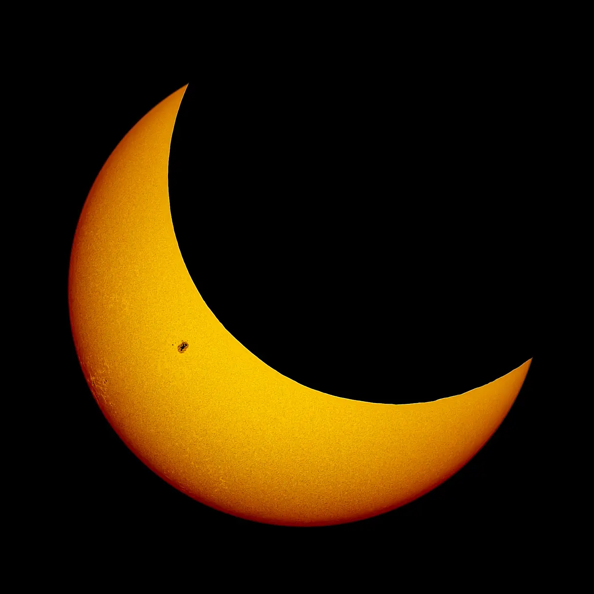 The Moon partially eclipsing the sun during a unique astronomical event.